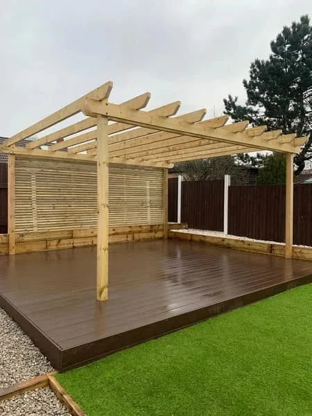 Newly built pergola over composite decking with artificial turf